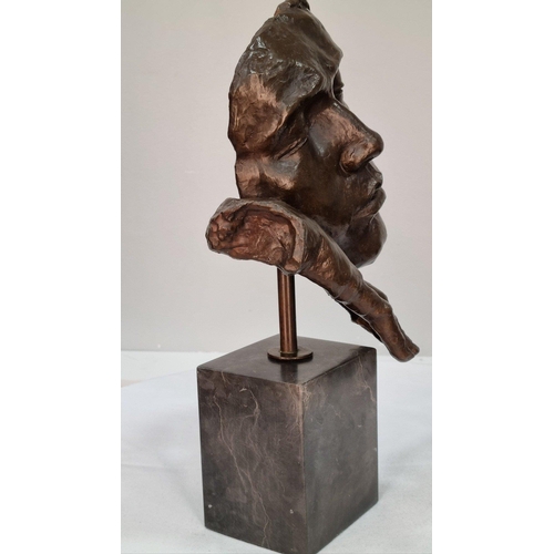 150 - A bronze sculpture of a face on solid marble base. H: 40cm  W: 27cm  D: 15cm#150