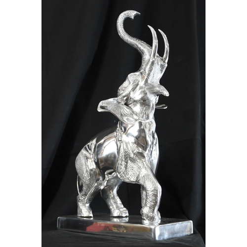 151 - A very large highly polished aluminium Elephant on base with super detail.. H: 68cm  W: 45cm  D: 40c... 