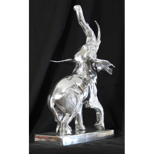 151 - A very large highly polished aluminium Elephant on base with super detail.. H: 68cm  W: 45cm  D: 40c... 