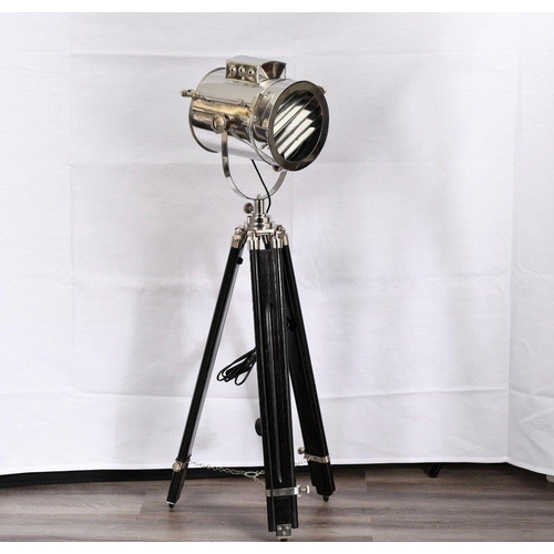 152 - A fully adjustable metal spotlight with wooden legs. The height of the legs can be adjusted and scre... 