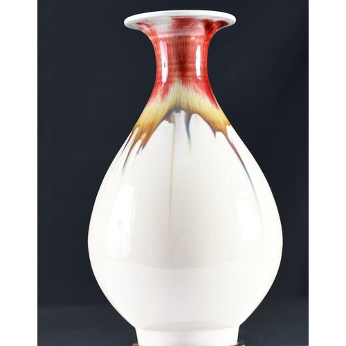 163 - A hand made Chinese porcelain vase with beautiful hand coloured detail using the drip glazing techni... 