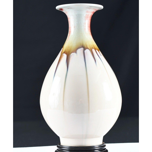 163 - A hand made Chinese porcelain vase with beautiful hand coloured detail using the drip glazing techni... 