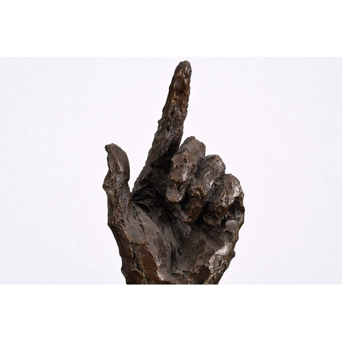 169 - This wonderfully obscure solid bronze casting of a human hand sits on a black marble base.. H: 38cm ... 