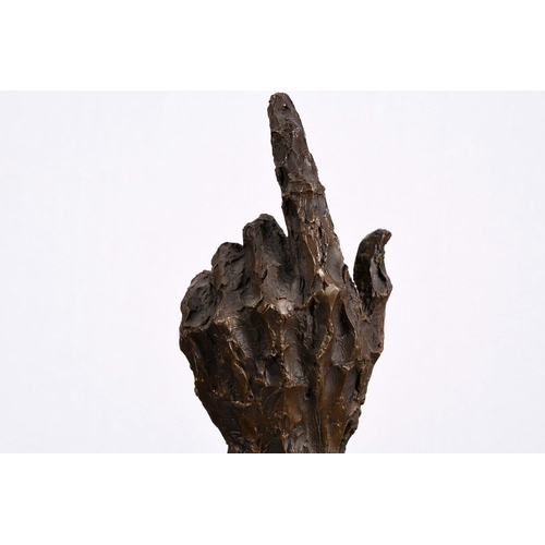 169 - This wonderfully obscure solid bronze casting of a human hand sits on a black marble base.. H: 38cm ... 