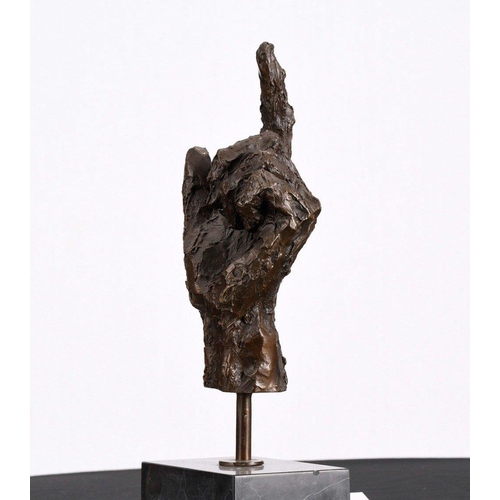 169 - This wonderfully obscure solid bronze casting of a human hand sits on a black marble base.. H: 38cm ... 