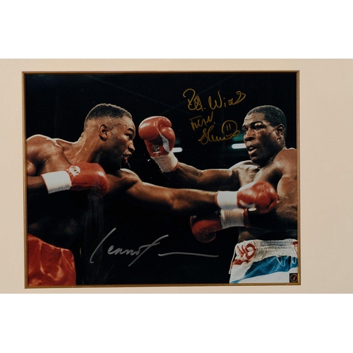 17 - A framed presentation incorporating a photograph of the famous fight between FRANK BRUNO  & LENN... 