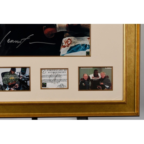 17 - A framed presentation incorporating a photograph of the famous fight between FRANK BRUNO  & LENN... 