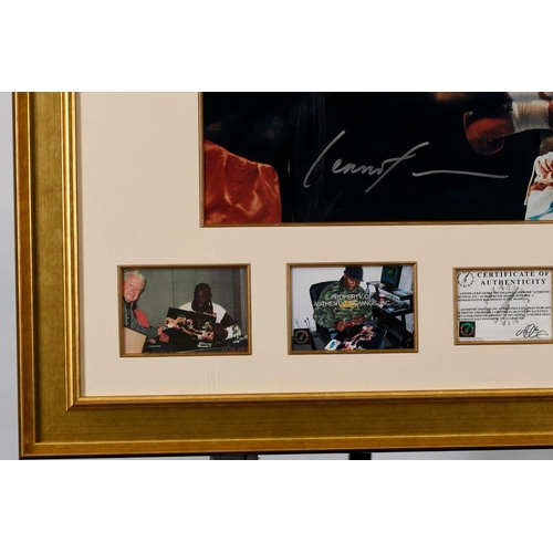 17 - A framed presentation incorporating a photograph of the famous fight between FRANK BRUNO  & LENN... 