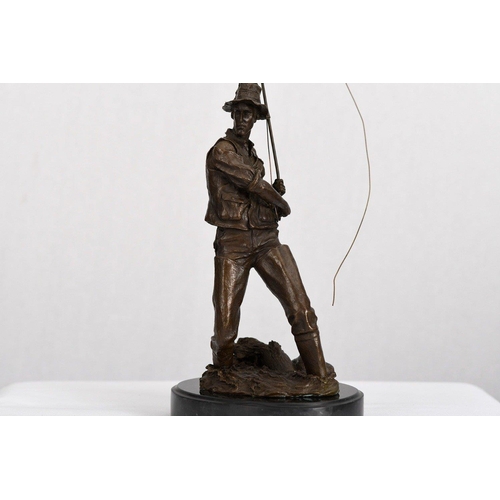 177 - A solid bronze detailed sculpture of a fisherman on a solid black marble base.. H: 46cm  W: 16cm  D:... 