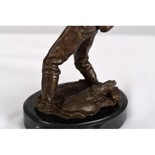 177 - A solid bronze detailed sculpture of a fisherman on a solid black marble base.. H: 46cm  W: 16cm  D:... 