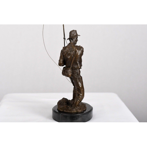 177 - A solid bronze detailed sculpture of a fisherman on a solid black marble base.. H: 46cm  W: 16cm  D:... 