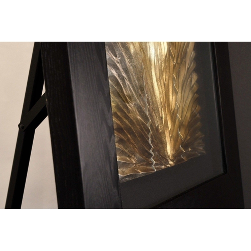 19 - A modern framed art with a gold & silver coloured hand carved wooden panel which has been set in... 