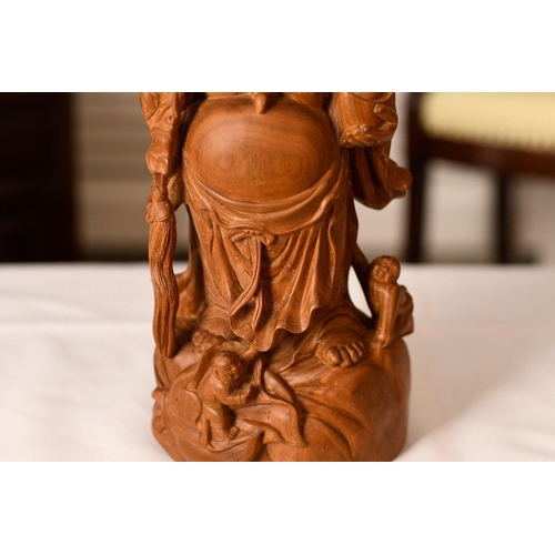 196 - A Buddha which has been wonderfully carved from once piece of sandalwood. Origin Zhejiang Province C... 