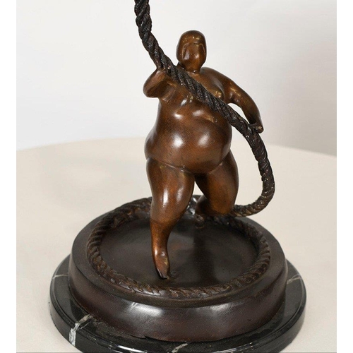 198 - A fabulous modern design of two climbing art figures on rope. Cast in bronze on a solid black marble... 