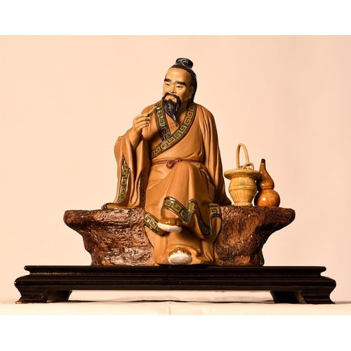 209 - A Shiwan original figure of a finely detailed man on a bench comes with a wooden plinth. Origin Fosh... 