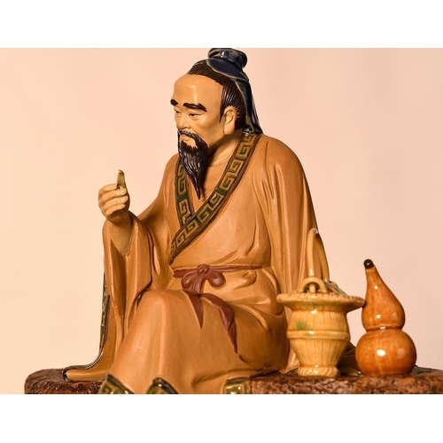 209 - A Shiwan original figure of a finely detailed man on a bench comes with a wooden plinth. Origin Fosh... 