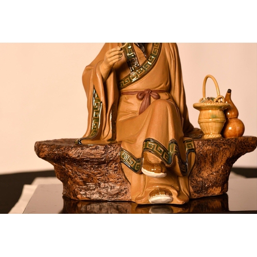 209 - A Shiwan original figure of a finely detailed man on a bench comes with a wooden plinth. Origin Fosh... 