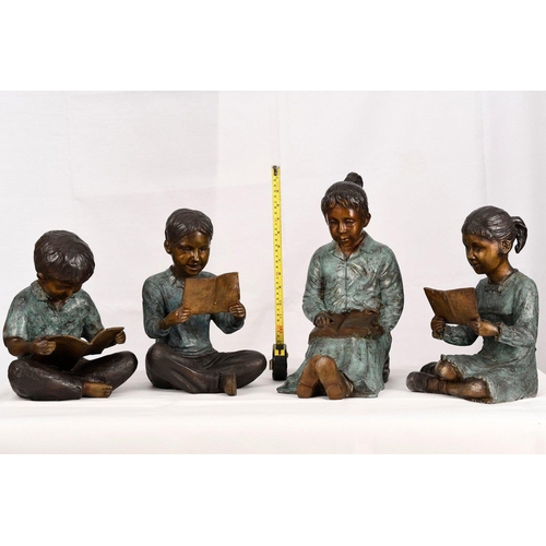 222 - A set of four hand cast bronze figures consisting of 3 children with their teacher. Lovely detail wi... 