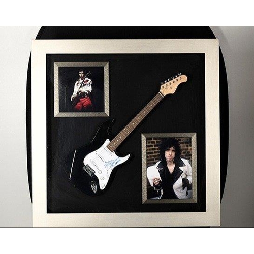 238 - A rare framed guitar which MICK JONES has signed the pick guard and also has signed the words 