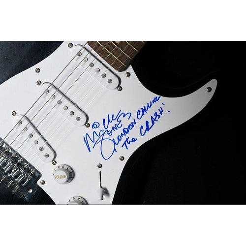 238 - A rare framed guitar which MICK JONES has signed the pick guard and also has signed the words 