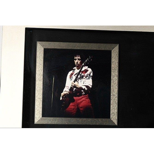 238 - A rare framed guitar which MICK JONES has signed the pick guard and also has signed the words 