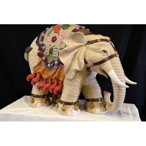 30 - An original Shiwan porcelain elephant which has been hand painted and decorated in fine detail. Orig... 