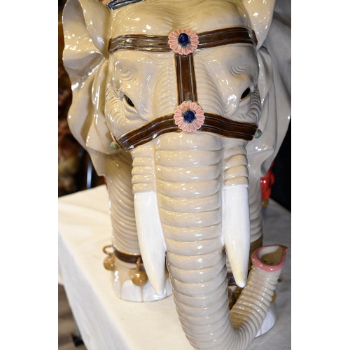 30 - An original Shiwan porcelain elephant which has been hand painted and decorated in fine detail. Orig... 