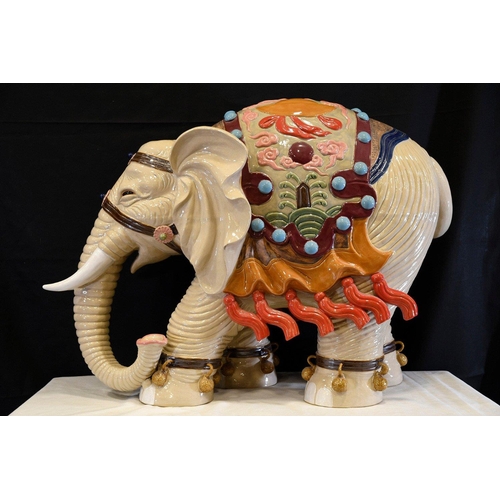 30 - An original Shiwan porcelain elephant which has been hand painted and decorated in fine detail. Orig... 