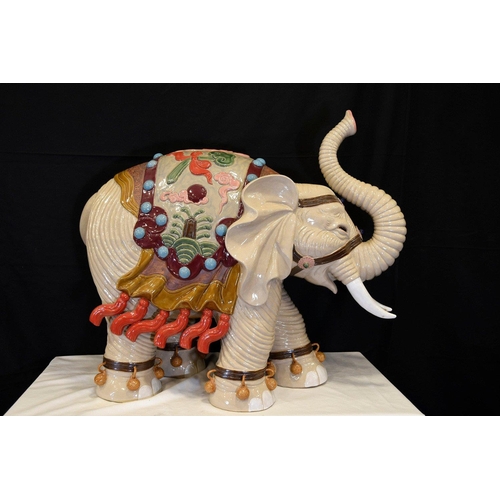 31 - An original Shiwan porcelain elephant which has been hand painted and decorated in fine detail. Orig... 