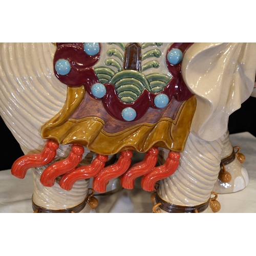 31 - An original Shiwan porcelain elephant which has been hand painted and decorated in fine detail. Orig... 