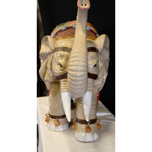 31 - An original Shiwan porcelain elephant which has been hand painted and decorated in fine detail. Orig... 