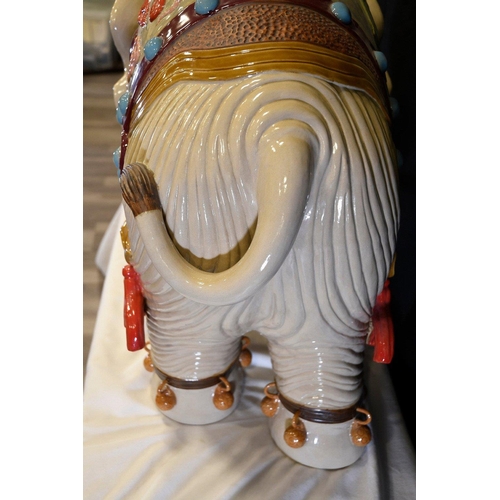 31 - An original Shiwan porcelain elephant which has been hand painted and decorated in fine detail. Orig... 