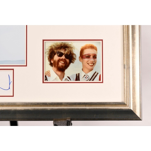 60 - A framed presentation of the iconic duo The EURYTHMICS which bears the original signature of DAVE ST... 