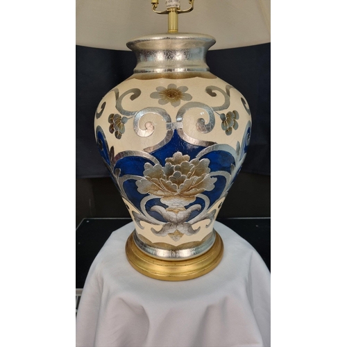 62 - A porcelain blue and cream hand painted lamp with embossed detail. Display shade shown supplied free... 