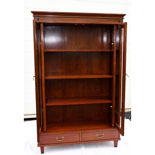 65 - A rosewood document cabinet/bookcase. This has two glass doors that slide back into the cabinet with... 