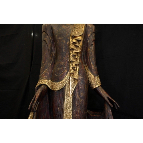 66 - An incredible 9ft high hand made wood carving of a Thai goddess hand decorated and finished with gol... 