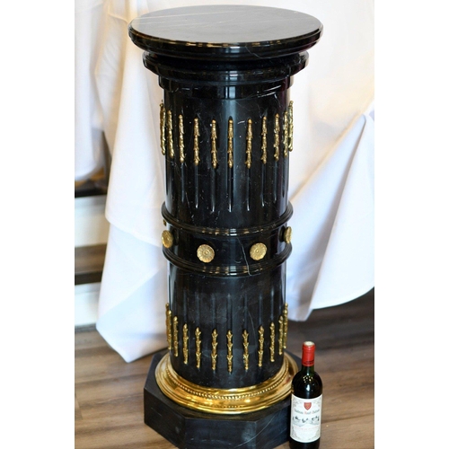 68 - A solid black marble plinth with brass detail fittings. Very highly polished and in excellent condit... 