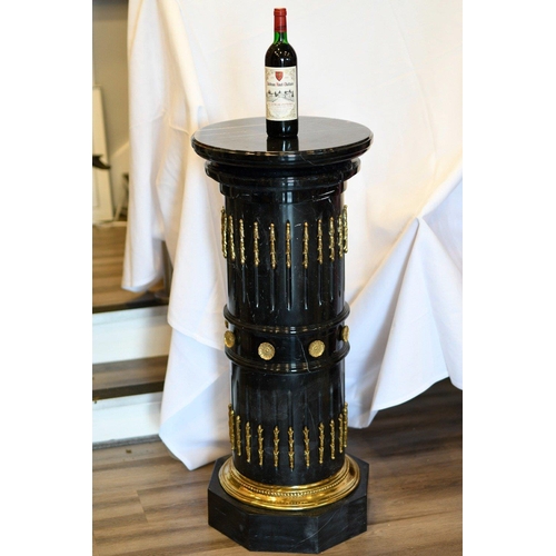 68 - A solid black marble plinth with brass detail fittings. Very highly polished and in excellent condit... 