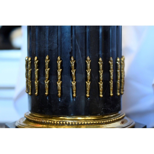 68 - A solid black marble plinth with brass detail fittings. Very highly polished and in excellent condit... 