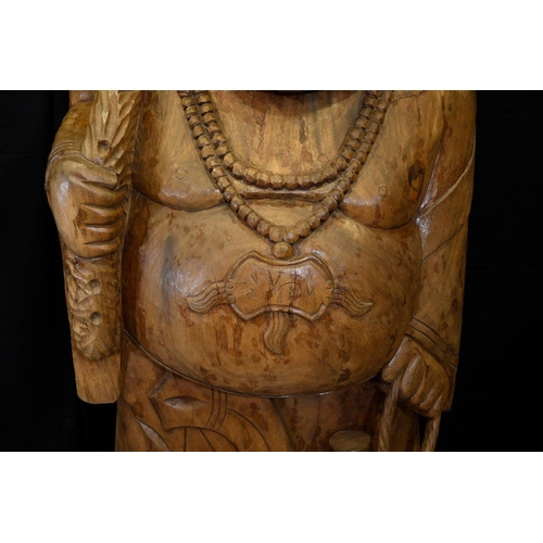 69 - A large very heavy wood carving of a Buddha standing approximately 5ft tall. Origin Thailand Circa 1... 