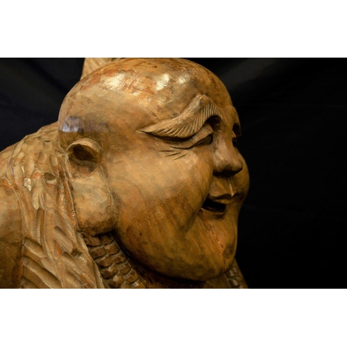 69 - A large very heavy wood carving of a Buddha standing approximately 5ft tall. Origin Thailand Circa 1... 