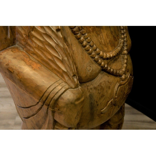 69 - A large very heavy wood carving of a Buddha standing approximately 5ft tall. Origin Thailand Circa 1... 