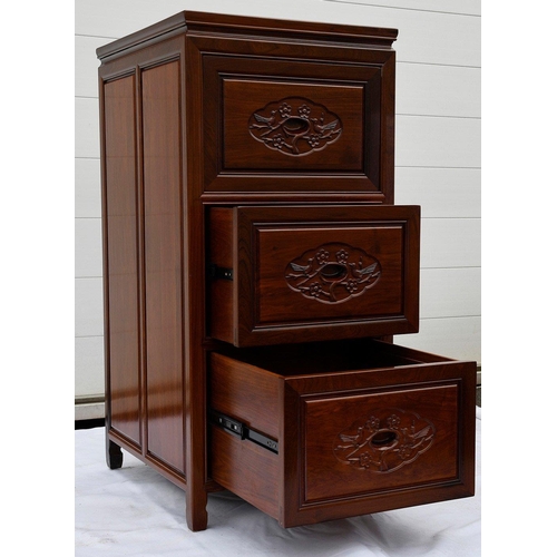 72 - A solid rosewood filing cabinet which houses three lockable drawers and displays a bird and flower m... 