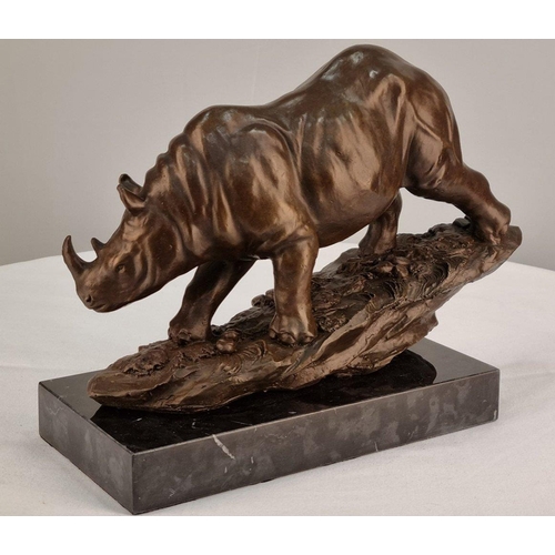 75 - A bronze casting of a Rhino with well sculpted detail on sold marble base. H: 22cm  W: 28cm  D: 12cm... 