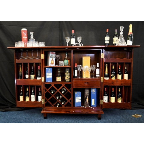 79 - A hand made rosewood folding bar with various compartments for bottles glasses and accoutrements (co... 