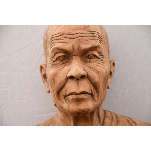 8 - A rare life size highly detailed carving made from solid teak depicting a standing monk. Origin Nort... 