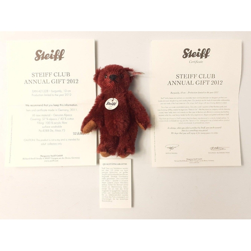 224 - A STEIFF CLUB 2012 burgundy teddy bear in its box, stands 10cm high with certificate#62