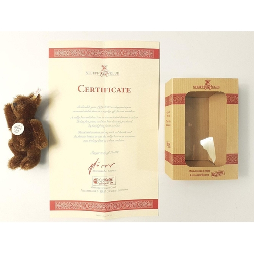 229 - A STEIFF CLUB 1999 brown teddy bear in its box, stands 7cm high with certificate#67