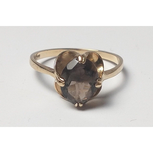 26 - A fully hallmarked gold ring with oval smokey quartz centre stone. Size O Total gross weight 1.9g ap... 