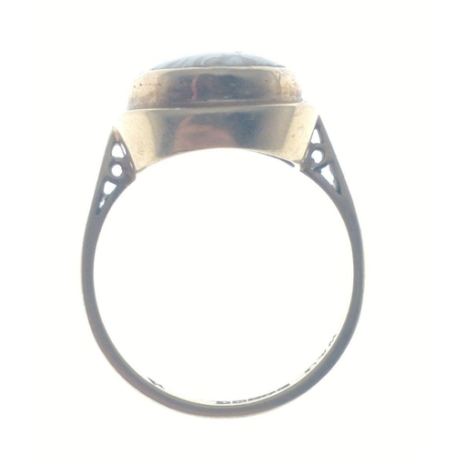 41 - A ring stamped 375 and 9ct, hallmarked for Birmingham 1973 set with an oval stone 15mm long, size N,... 